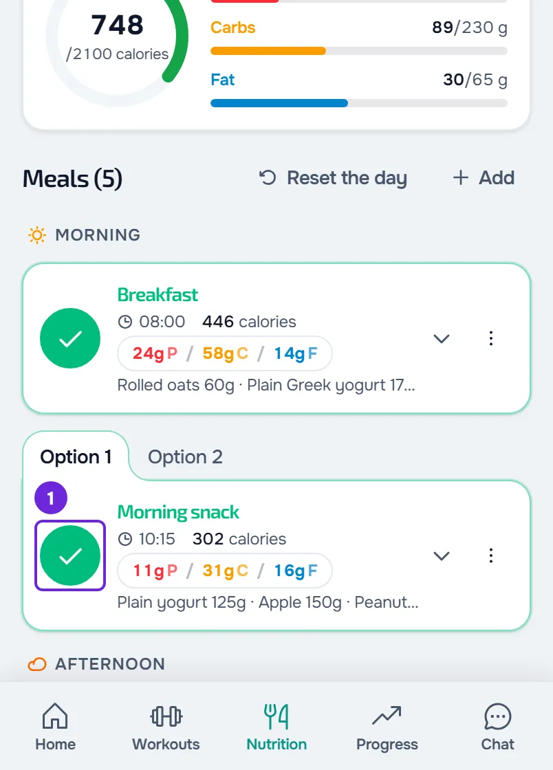 The morning snack marked as eaten on a phone: green circle with a tick, green outline, the card closed and the day’s ring at 748 calories.